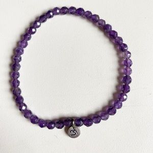 Satya stretch bracelet, like new. Amethyst, Om